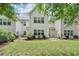 Manicured backyard and back exterior with well maintained lawn and patio at 2910 Cross Creek Dr, Cumming, GA 30040