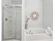 Modern bathroom showcasing a separate tub, shower and tiled wall at 2910 Cross Creek Dr, Cumming, GA 30040
