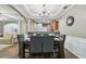 Open-concept dining room with hardwood floors and an archway view of the living room at 2910 Cross Creek Dr, Cumming, GA 30040