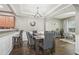 Elegant dining room with hardwood floors, modern chandelier, and seating for six at 2910 Cross Creek Dr, Cumming, GA 30040