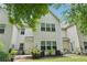 View of back exterior with patio and well maintained lawn at 2910 Cross Creek Dr, Cumming, GA 30040