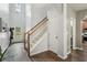 Bright foyer with hardwood floors, staircase, and a view to the front door at 2910 Cross Creek Dr, Cumming, GA 30040
