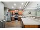 Spacious kitchen featuring stainless steel appliances, wooden cabinets and counter seating at 2910 Cross Creek Dr, Cumming, GA 30040