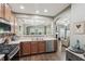 Kitchen provides views and access to the living area and boasts stainless appliances at 2910 Cross Creek Dr, Cumming, GA 30040
