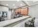 Kitchen with stainless steel appliances, wooden cabinets, and a breakfast bar with stools at 2910 Cross Creek Dr, Cumming, GA 30040