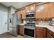 Efficient kitchen layout with stainless steel appliances and plenty of cabinet storage at 2910 Cross Creek Dr, Cumming, GA 30040