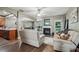 Open-concept living room showcasing hardwood floors and seamless flow to the kitchen at 2910 Cross Creek Dr, Cumming, GA 30040