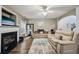 Comfortable living area boasting a fireplace, hardwood floors and ample seating at 2910 Cross Creek Dr, Cumming, GA 30040