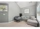Comfortable living room with gray walls, a sectional sofa, and a cozy papasan chair at 2910 Cross Creek Dr, Cumming, GA 30040