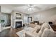 Cozy living room featuring a fireplace, hardwood floors, and neutral color palette at 2910 Cross Creek Dr, Cumming, GA 30040