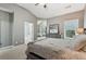 Main bedroom with high ceilings, neutral walls, and an ensuite bathroom at 2910 Cross Creek Dr, Cumming, GA 30040