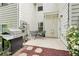 Charming outdoor patio with a grill, seating, and landscaping at 2910 Cross Creek Dr, Cumming, GA 30040