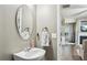 Stylish powder room with a modern mirror, contemporary fixtures, and attractive design at 2910 Cross Creek Dr, Cumming, GA 30040