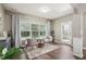 Cozy sitting area with hardwood floors, natural light, and comfortable seating at 2910 Cross Creek Dr, Cumming, GA 30040