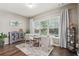 Comfortable sitting area with natural light, hardwood floors, and neutral decor at 2910 Cross Creek Dr, Cumming, GA 30040