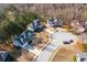 Aerial view of a residential neighborhood showcasing the layout and surrounding trees at 3448 Craggy Perch, Douglasville, GA 30135