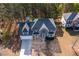 Aerial view of a spacious home with well-maintained landscaping, driveway, and mature trees in a serene neighborhood at 3448 Craggy Perch, Douglasville, GA 30135