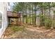Large backyard with mature trees, providing ample space for outdoor activities and entertainment at 3448 Craggy Perch, Douglasville, GA 30135