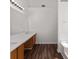 Bathroom featuring double sinks, ample counter space, wood-look flooring, and a bright mirror, creating a functional space at 3448 Craggy Perch, Douglasville, GA 30135