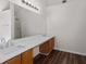 Bathroom showcasing double sinks, generous counter space, wood-look flooring, and a bright vanity mirror at 3448 Craggy Perch, Douglasville, GA 30135