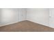 Bedroom with a double door entry, neutral paint, and neutral carpet at 3448 Craggy Perch, Douglasville, GA 30135
