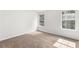 Bright bedroom featuring two large windows and neutral walls at 3448 Craggy Perch, Douglasville, GA 30135