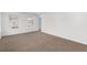 Bright and airy carpeted bedroom with natural light streaming through two windows, offering a calming and peaceful ambiance at 3448 Craggy Perch, Douglasville, GA 30135