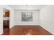 Bright dining room features a chandelier, wainscotting, and hardwood flooring at 3448 Craggy Perch, Douglasville, GA 30135