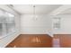 Bright dining room features a chandelier, wainscotting, and hardwood flooring at 3448 Craggy Perch, Douglasville, GA 30135