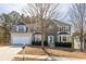 Charming two-story home featuring a stone facade and a well-manicured front lawn at 3448 Craggy Perch, Douglasville, GA 30135
