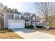 Inviting two-story home with a two-car garage and a long driveway, nestled in a wooded area at 3448 Craggy Perch, Douglasville, GA 30135