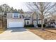 Attractive two-story home with a stone facade and two-car garage; long driveway at 3448 Craggy Perch, Douglasville, GA 30135