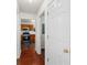 Hallway leading to a kitchen featuring stainless steel appliances and wood cabinets at 3448 Craggy Perch, Douglasville, GA 30135