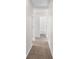 Neutral hallway featuring fresh, light paint and leads to various rooms at 3448 Craggy Perch, Douglasville, GA 30135
