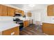 Well-lit kitchen with stainless steel appliances, oak cabinets, and lovely flooring at 3448 Craggy Perch, Douglasville, GA 30135