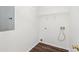 Practical laundry room with vinyl flooring and essential hookups and shelving at 3448 Craggy Perch, Douglasville, GA 30135