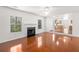 Open-concept living area featuring a fireplace and a view to the kitchen at 3448 Craggy Perch, Douglasville, GA 30135