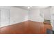 Spacious living room with hardwood floors, staircase, fireplace, and neutral paint at 3448 Craggy Perch, Douglasville, GA 30135