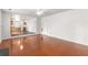 Open-concept living room features hardwood floors and provides seamless flow into the kitchen at 3448 Craggy Perch, Douglasville, GA 30135