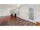 Spacious living room features gleaming hardwood floors, a fireplace, and a French door at 3448 Craggy Perch, Douglasville, GA 30135