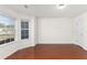 Bright living room with beautiful hardwood floors and large windows at 3448 Craggy Perch, Douglasville, GA 30135