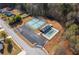 Aerial view of tennis courts, pool and parking area at 3448 Craggy Perch, Douglasville, GA 30135