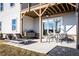 Home's backyard features a covered porch, rear deck, and open-air dining area with room to lounge at 4720 Montane St, Cumming, GA 30028