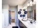 Bathroom boasts double vanity, modern fixtures, and a glass-enclosed shower area at 4720 Montane St, Cumming, GA 30028