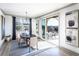 Bright dining room with patio access, featuring a modern chandelier, neutral color palette, and stylish decor at 4720 Montane St, Cumming, GA 30028