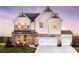 Charming two-story home showcasing a blend of board and batten siding and brick, creating a modern farmhouse aesthetic at 4720 Montane St, Cumming, GA 30028
