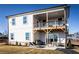 Two-story home featuring a covered deck, and a patio area perfect for outdoor entertaining at 4720 Montane St, Cumming, GA 30028