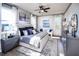 Bright main bedroom with stylish decor, hardwood floors, and a modern ceiling fan at 4720 Montane St, Cumming, GA 30028
