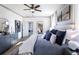 Main bedroom features a ceiling fan, ensuite, and a view of the home's rear deck at 4720 Montane St, Cumming, GA 30028