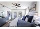 Main bedroom features a ceiling fan, ensuite, and a view of the home's rear deck at 4720 Montane St, Cumming, GA 30028